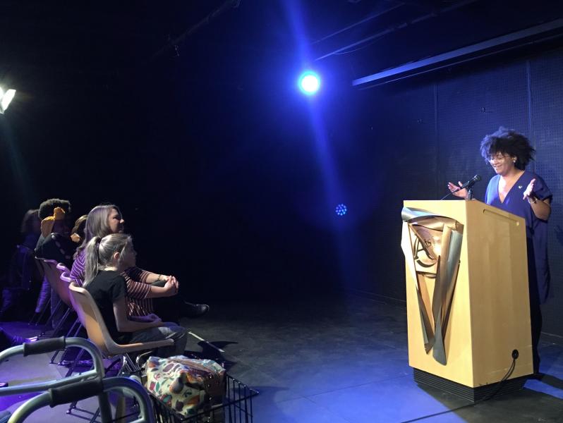 Poet Rachel Atakpa speaks at an event hosted by The Raven Book Store.